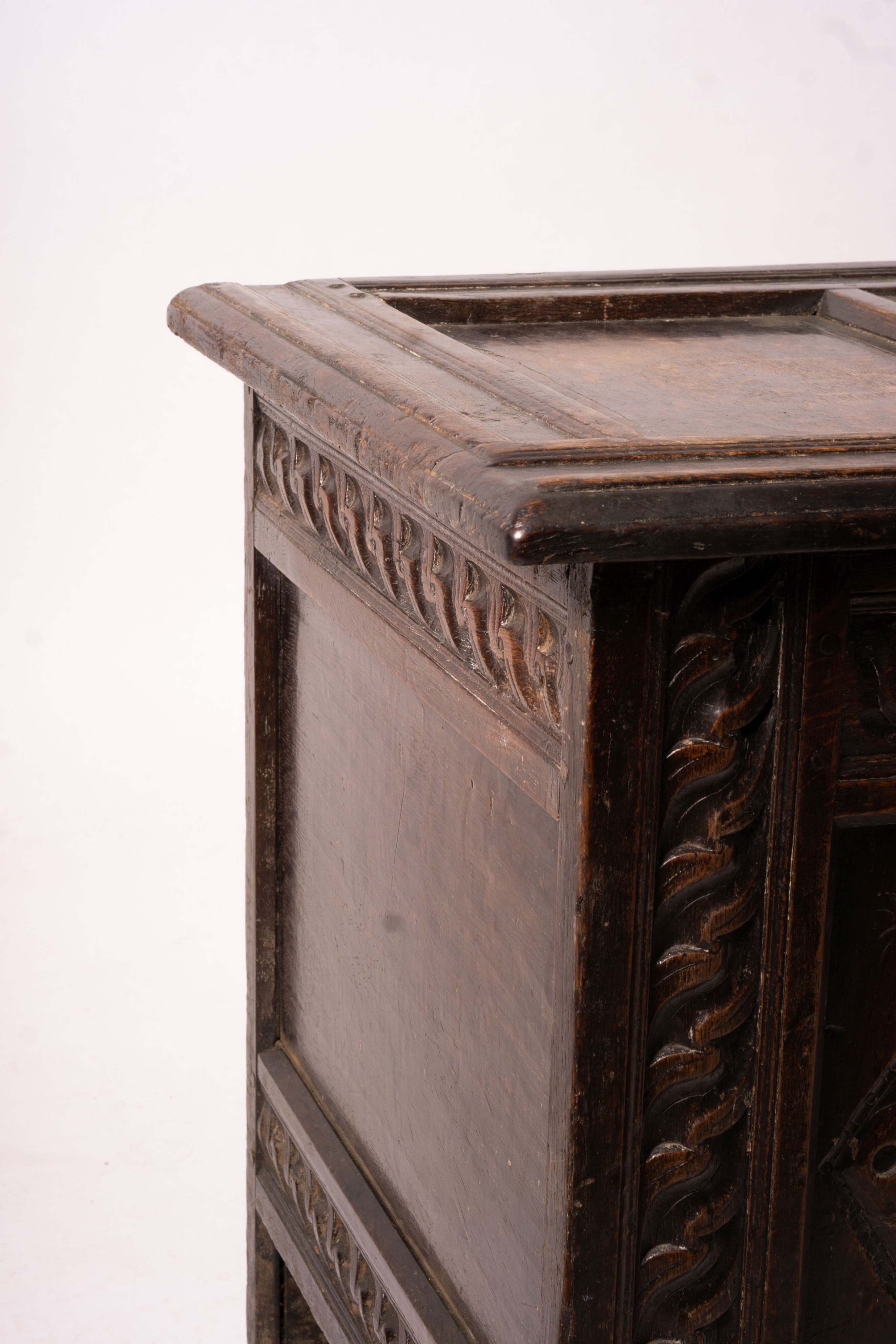 A 17th century carved panelled oak coffer, length 115cm, depth 56cm, height 67cm